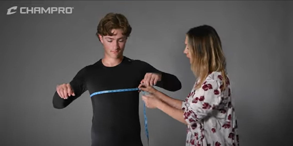 Load video: A quick and helpful video tutorial to show how to properly take measurements for use in ordering Champro apparel products.